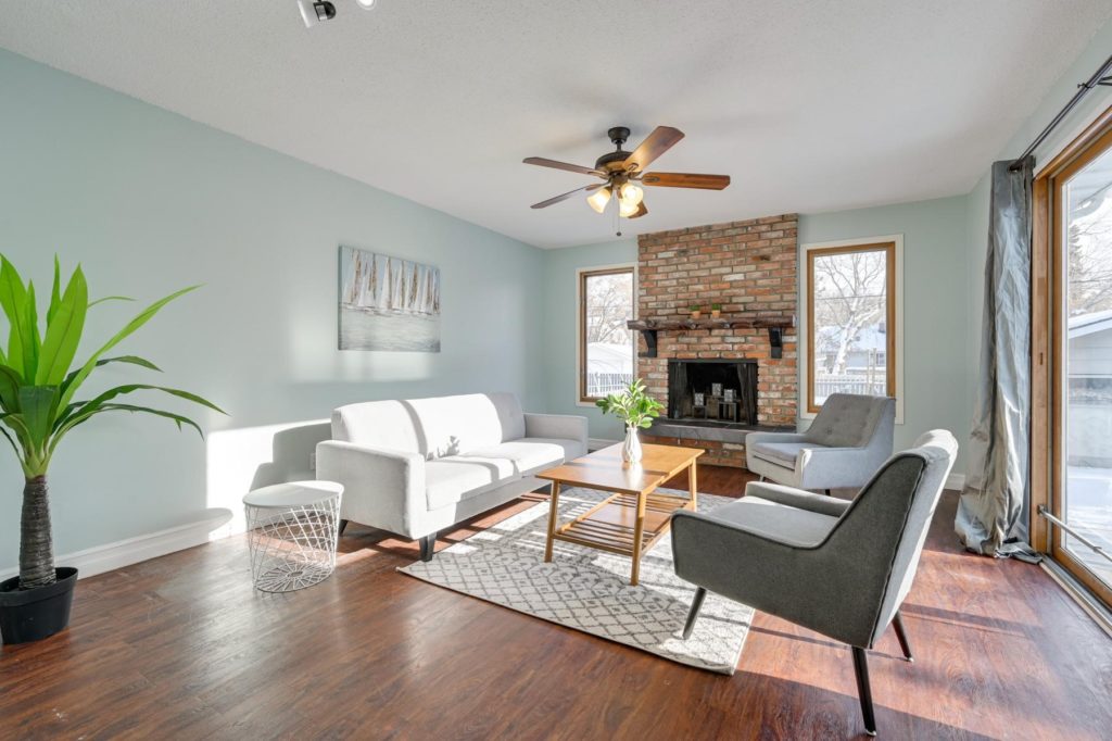 beautiful professionally staged home with hardwood floors and soft green walls